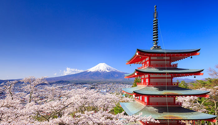 mount fuji and a traditional japanese building